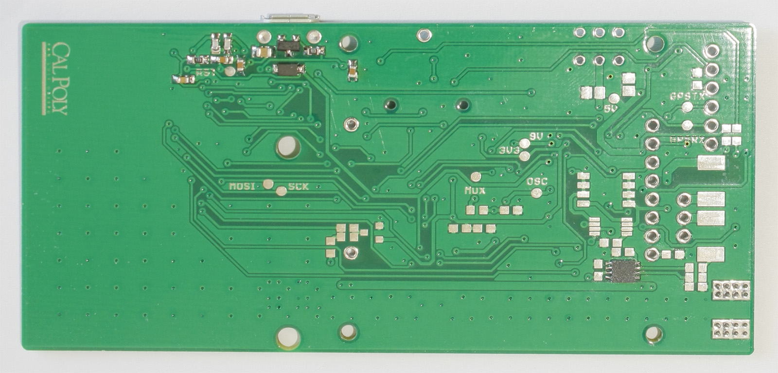 Bottom of PCB after soldering MCU section and reflowing SMD LiPo monitor IC